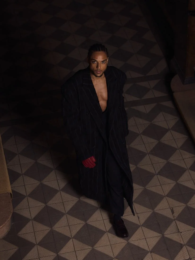 Lamin Leroy Gibba stylist Klass Hammer photo Leon Nevill Gallagher LE MILE Magazine Lamin wears a coat by Juun.J, a blazer and pants by Karl Lagerfeld, and gloves by H&M Studio