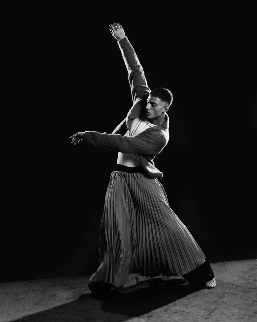 LE MILE Magazine Dancer Simone Emili editorial photo Cosimo Buccolieri Simone wears a cardigan by FIVEFOURFIVE, a tank top by SANDRO, a skirt by ACT N1, and pants by SETCHU