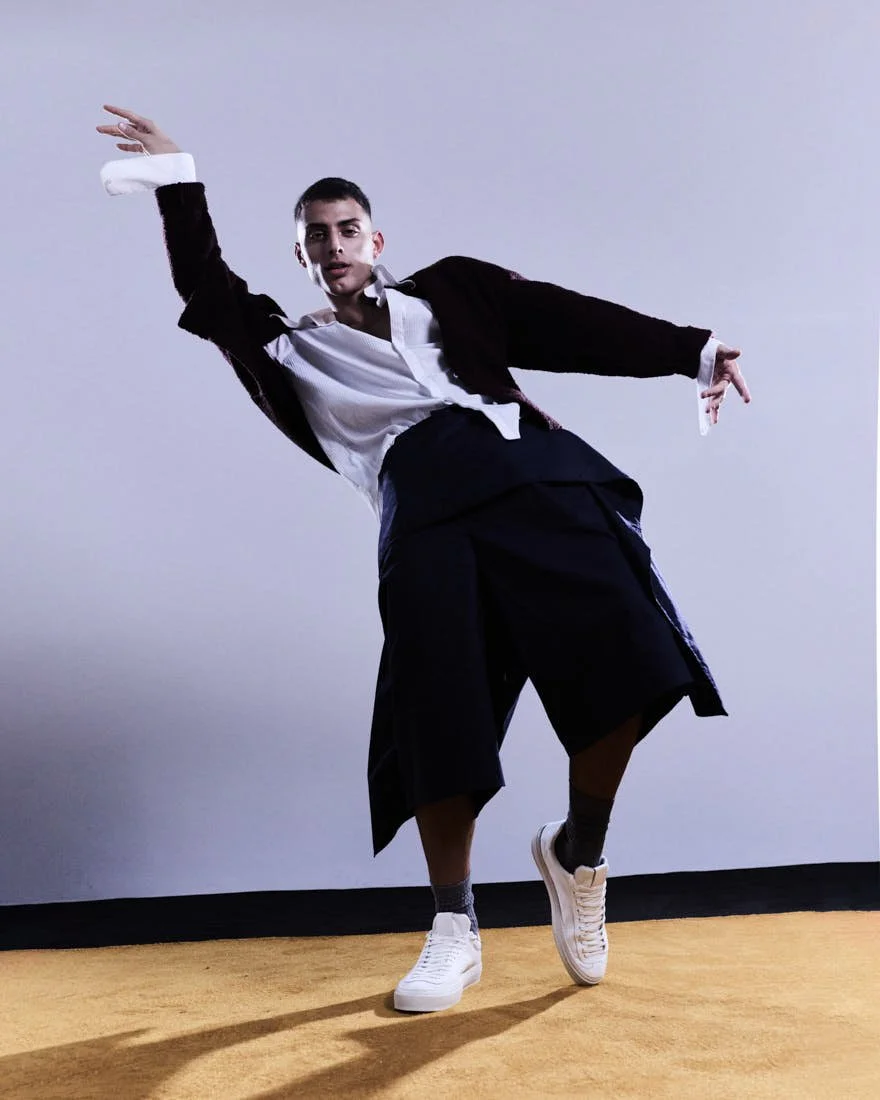 LE MILE Magazine Dancer Simone Emili editorial photo Cosimo Buccolieri Simone wears a cardigan by FIVEFOURFIVE, a shirt by CANAKU, shorts by HED MAYNER, and shoes by AQVA ALTA