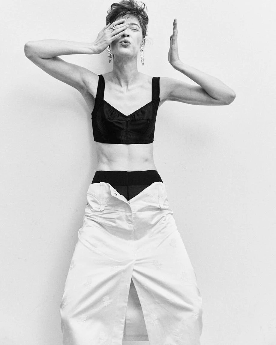 CATERINA DEORDIEVA LE MILE Magazine Antonio Grotti editorial SS26 womenswear Caterina wears top by DOLCE&GABBANA, skirt by TORY BURCH, shoes by GIUSEPPE ZANOTTI, jewellery by VOODOO JEWELS and tights by CALZEDONIA