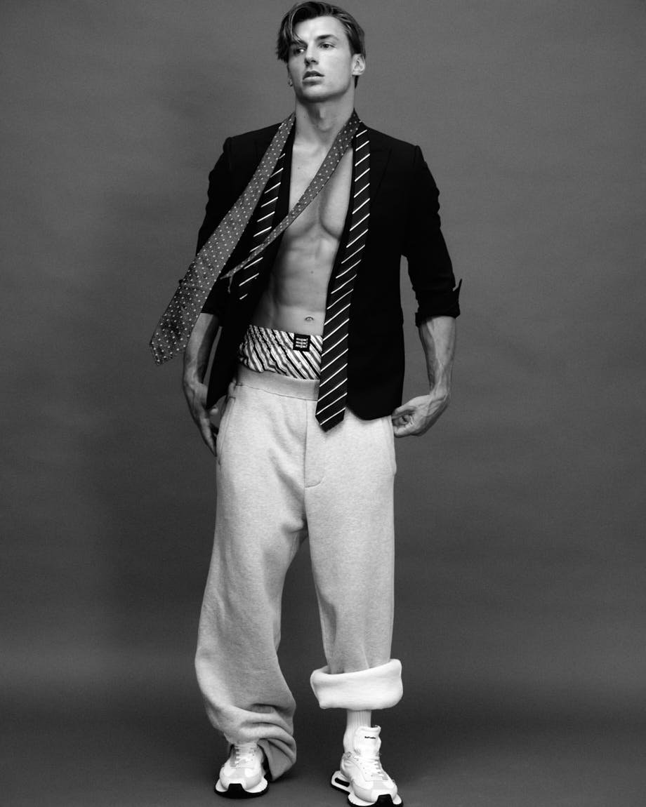 TED PULLIN LE MILE Magazine SS26 Runner Interview Fashion Editorial Luxury Brands Ted wears blazer, pants, and ties by DSQUARED2, shorts by MSGM, and shoes by BEPOSITIVE