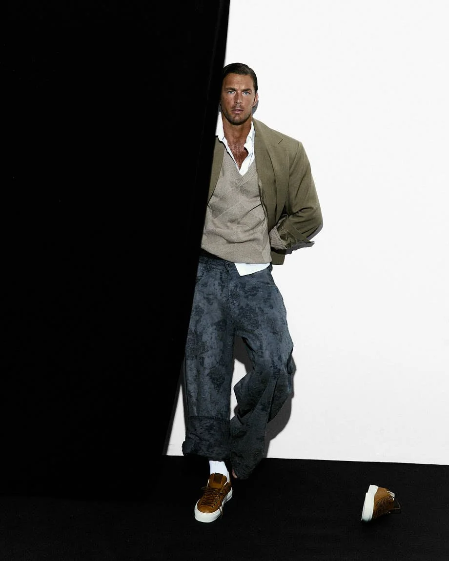 LE MILE Magazine Digital Cover CHRISTIAN HOGUE SS26 Christian wears blazer by THE FRANKIE SHOP, sweater vest by CANALI, shirt by MICHAEL KORS, jeans by DIESEL and shorts by FENDI