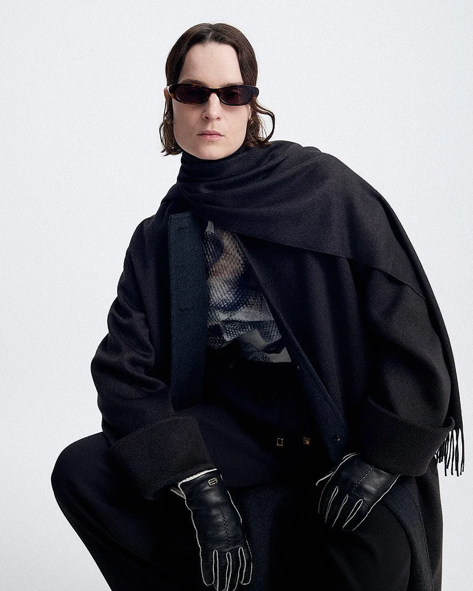 AGNONA Autumn/Winter 2026 womenswear portrait with dark outerwear, draped scarf, leather gloves and sunglasses, LE MILE Magazine.