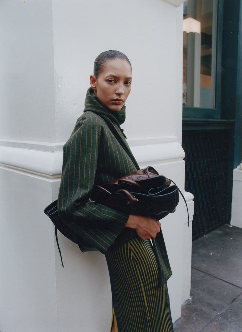 CHRIS SAULNIER LE MILE Magazine NYC WINTER BREATH FW25 Story Maria wears a dress by OOTO, a coat by Mola Walker, a bag by Radica Studio, and shoes by Femme Liberee.