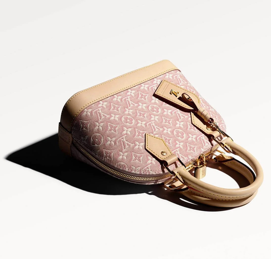 Louis Vuitton Alma bag in pink Monogram Emblème Rose Ruban jacquard with natural leather trims, top handles, gold-tone hardware and a padlock, photographed on a white background