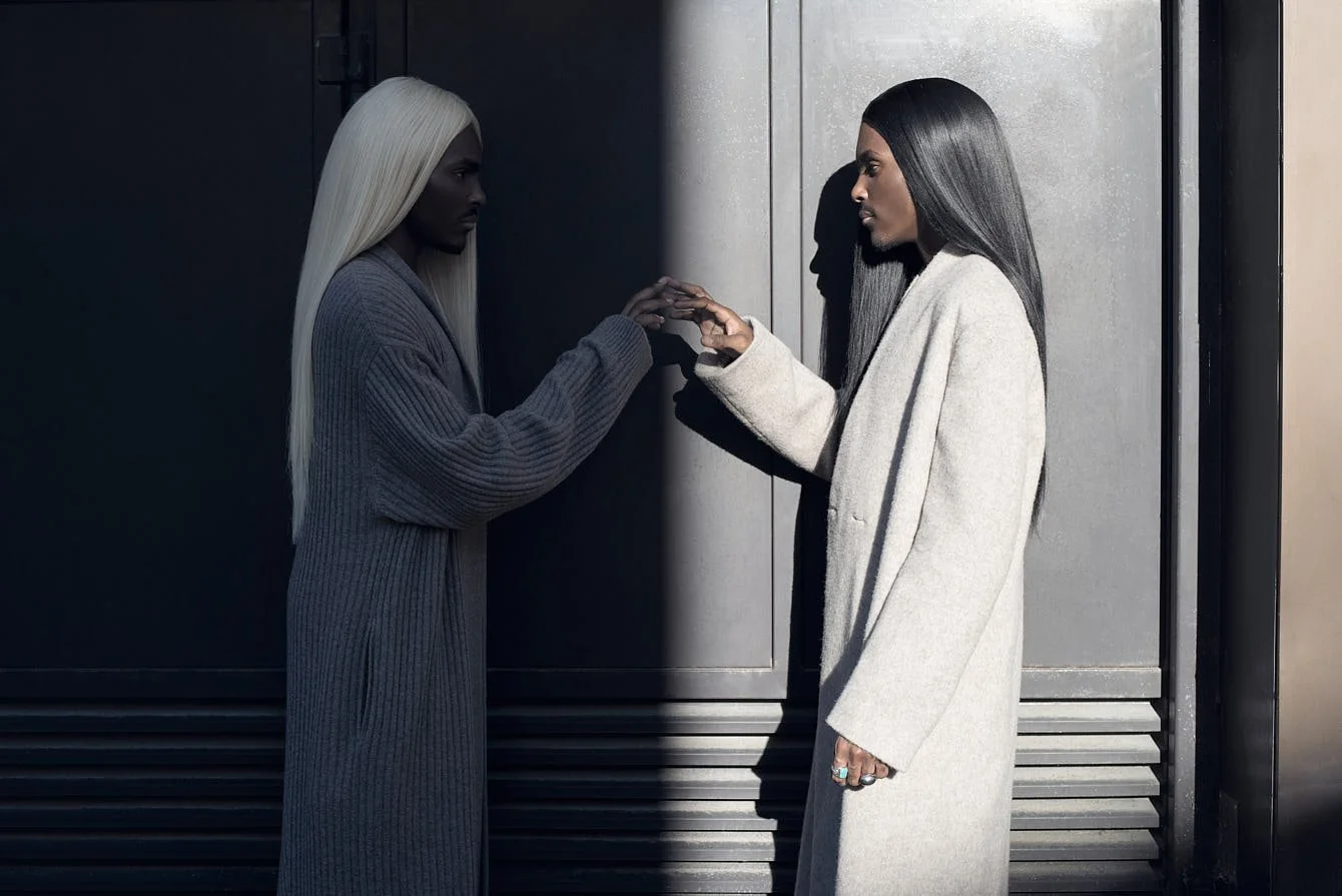 The Atanga Twins for LE MILE Magazine photo by-Olesya Parfenyuk Carlsen Atanga wears a wool coat by CHEN SIFAN, shorts by MOUTY and shoes by CHRISTIAN LOUBOUTIN. Curtis Atanga wears a coat by MOUTY and shoes by CHRISTIAN LOUBOUTIN.