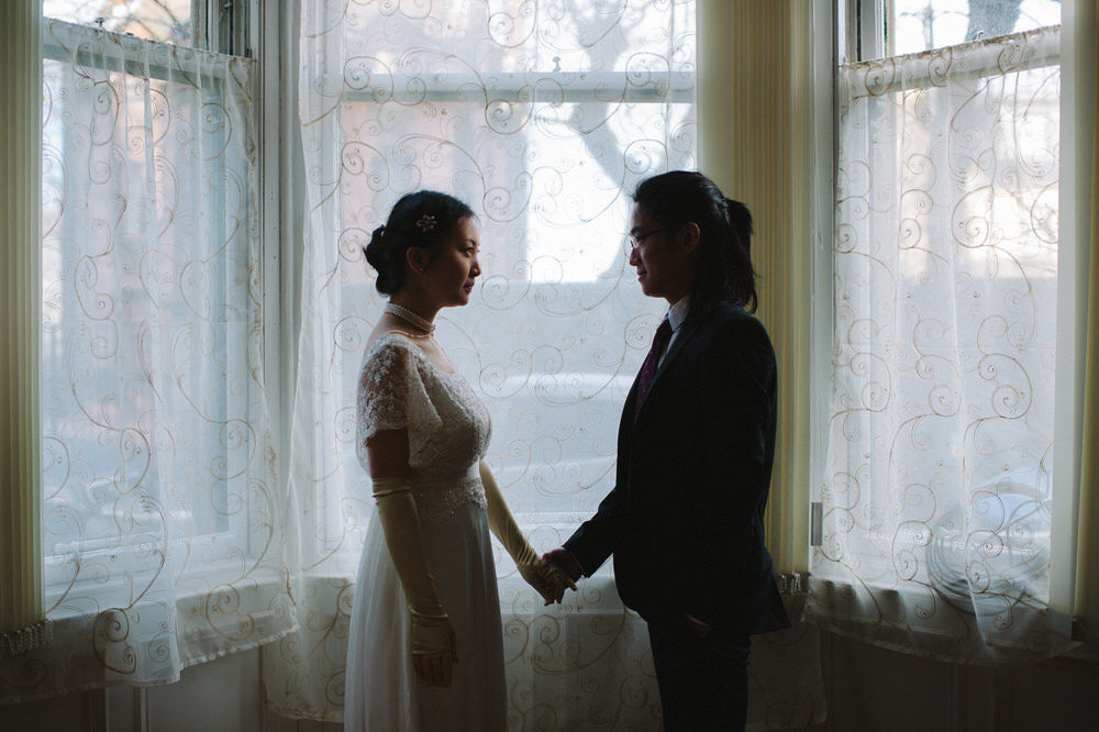 008-Couple-Wedding-Portrait-Window-Holding-Hands-Glasgow-Tenement.jpg