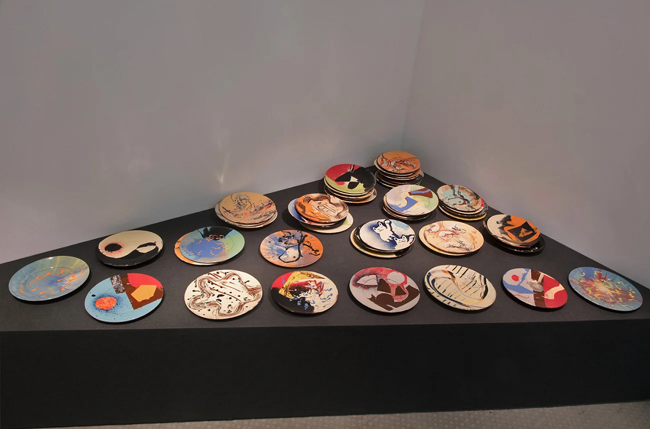 Fifty Slipware Plates (coming out as a potter) , 2017, earthenware, slips, transparent glaze, Exeter Phoenix, photo Jamie Woodley