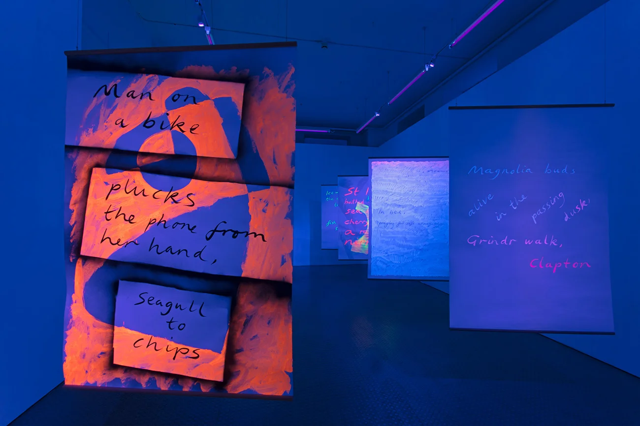 Installation view, Black Light Poems , 2017, UV reactive acrylic and spray paint, ink on paper, oak beading, Exeter Phoenix, photo Jamie Woodley