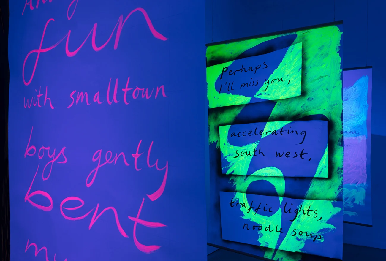 Installation view, Black Light Poems , 2017, UV reactive acrylic and spray paint, ink on paper, oak beading, Exeter Phoenix, photo Jamie Woodley