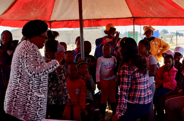Grace and Rupa dance with the learners