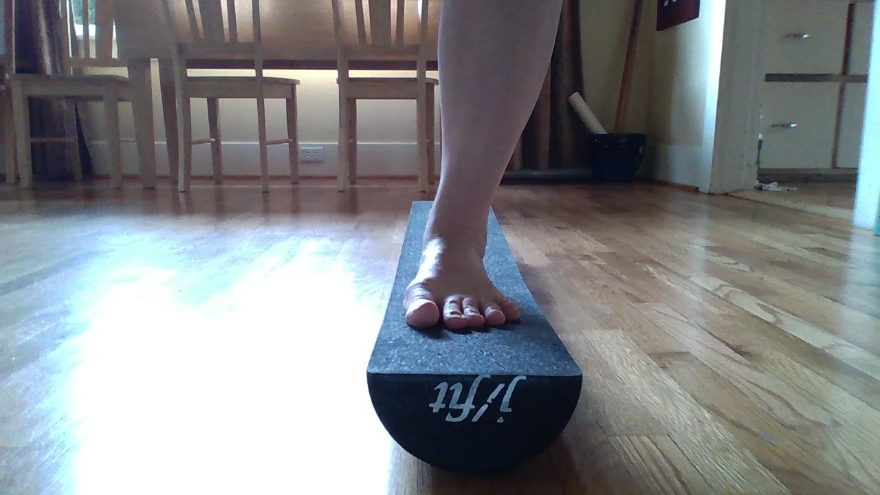 Balancing for 1 minute on the half roller, hard version.