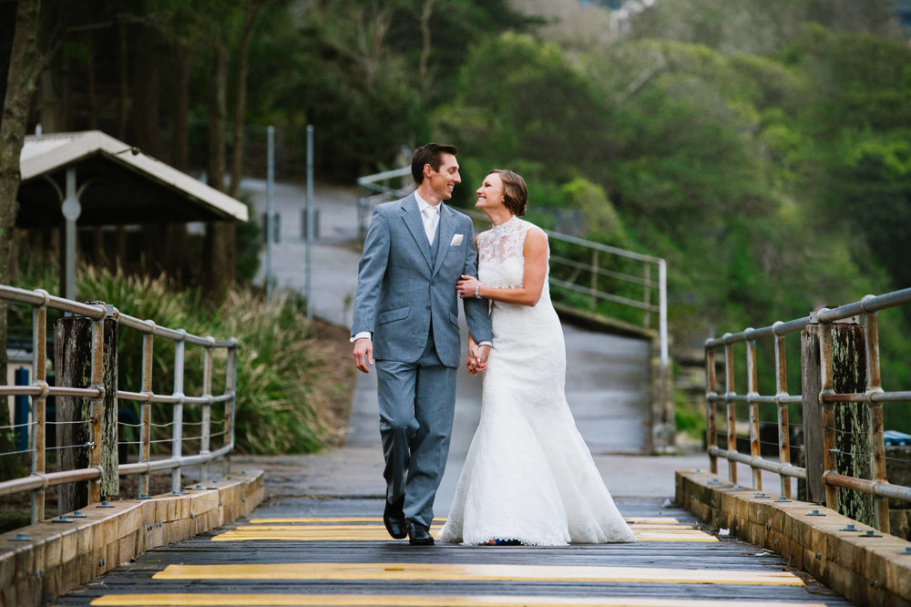 Bride and groom walking Little Manly Beach