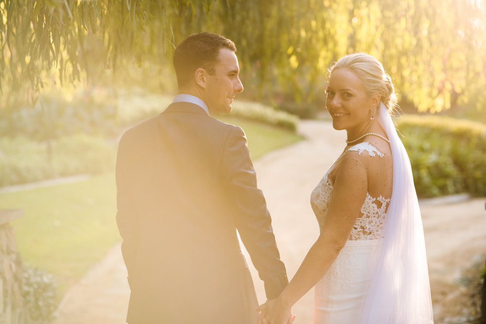 Bride and groom in garden