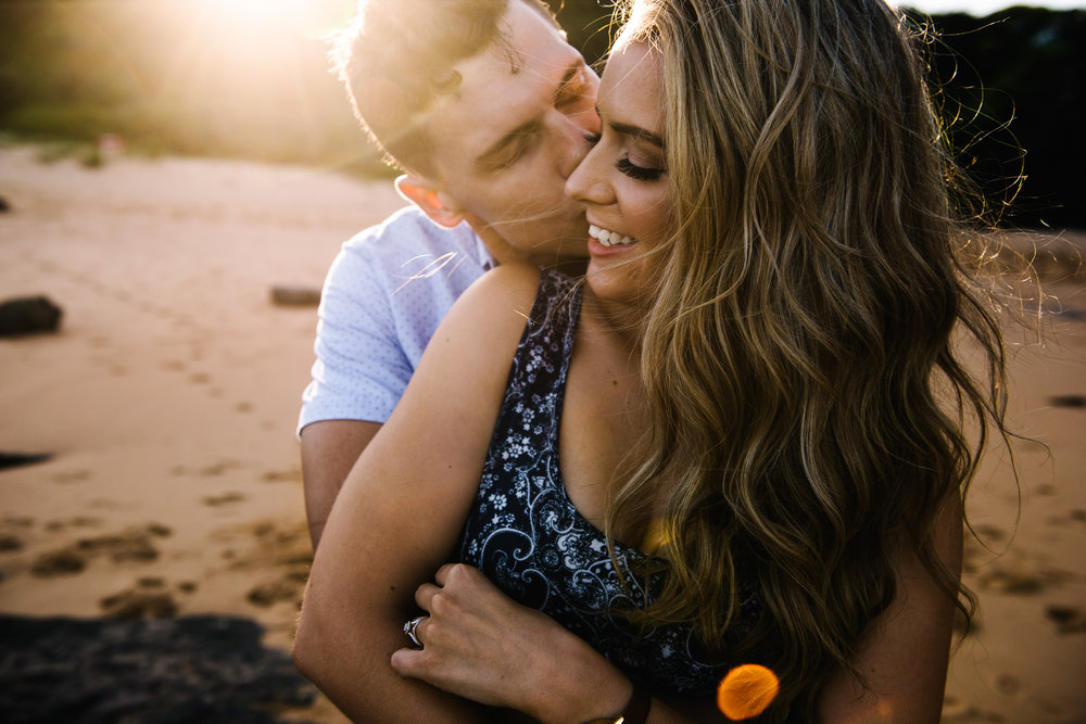 Engaged couple on beach