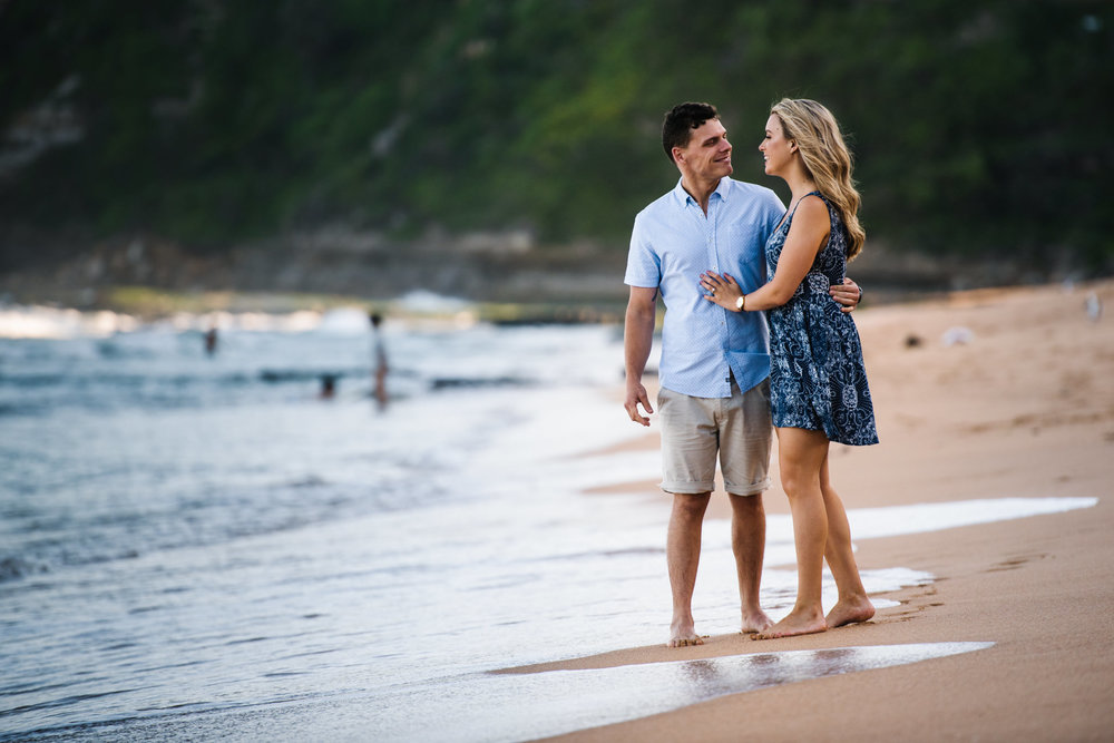 Engaged couple on the shore