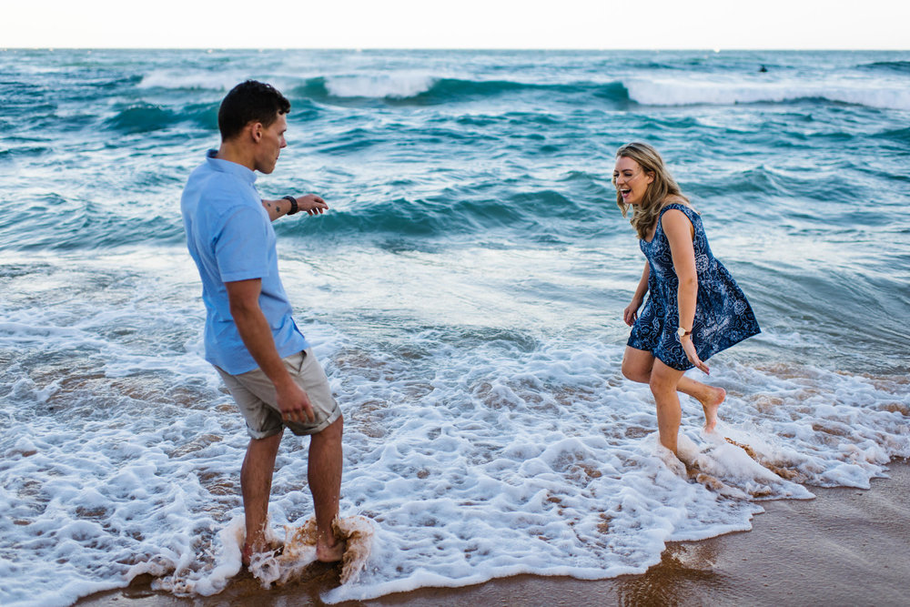 Couple playing in the waves