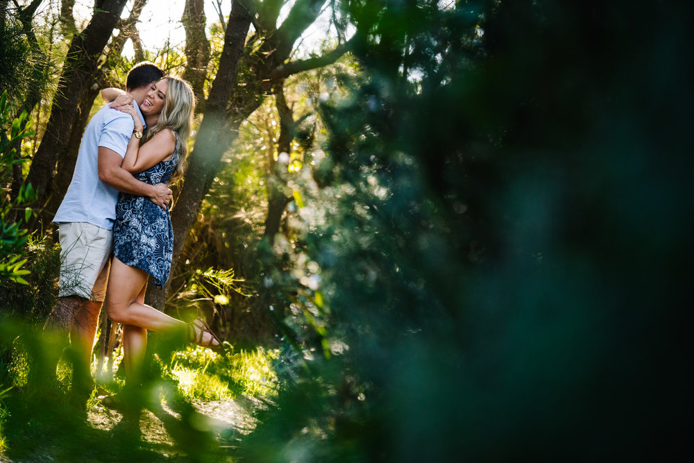 Engaged couple in forest scene