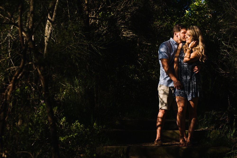 Engaged couple in forest