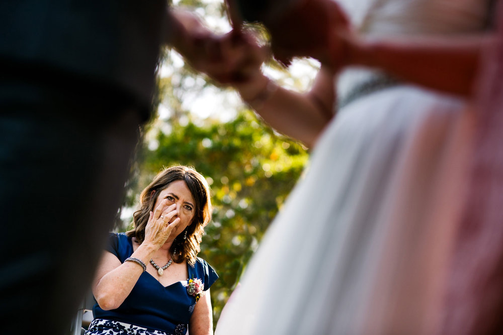 Mother wipes away tears watching her daughter get married at Greenfield Farm Estate
