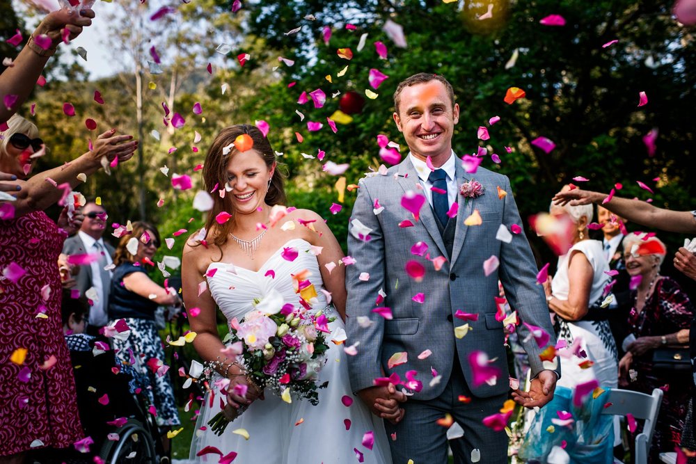 Greenfield Farm wedding recessional with rose petal confetti
