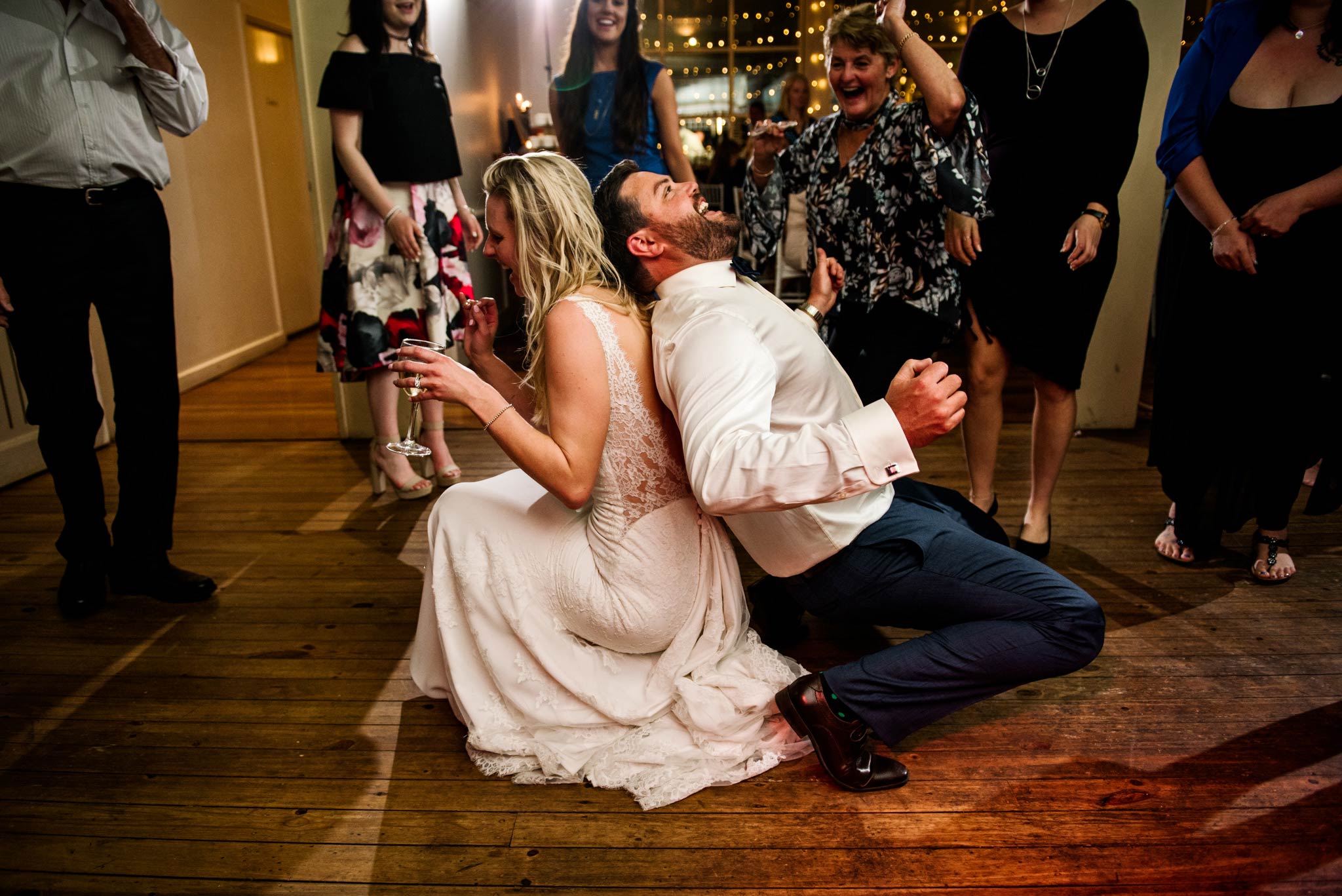 Bride and groom dancing back to back and laughing at Wandin Valley Estate reception