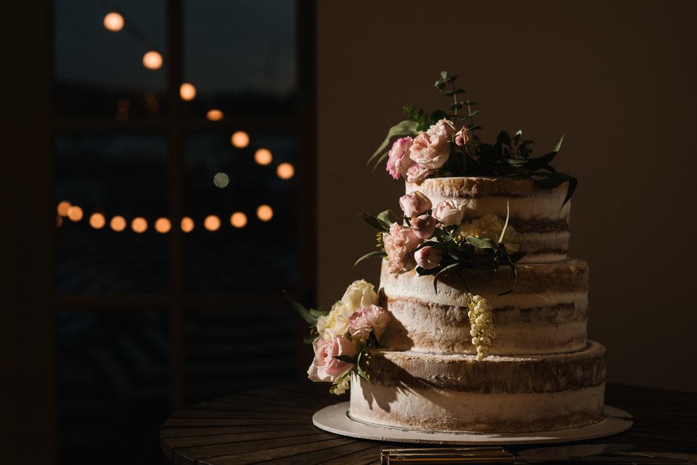 Pretty three tiered cake with floral accents