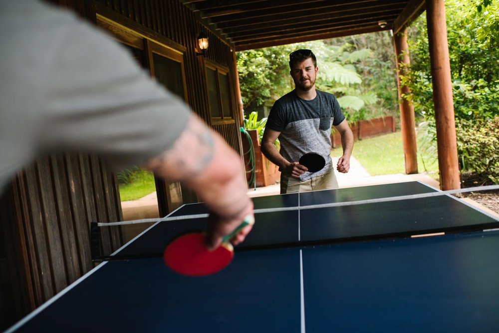 Groom playing table tennis before wedding