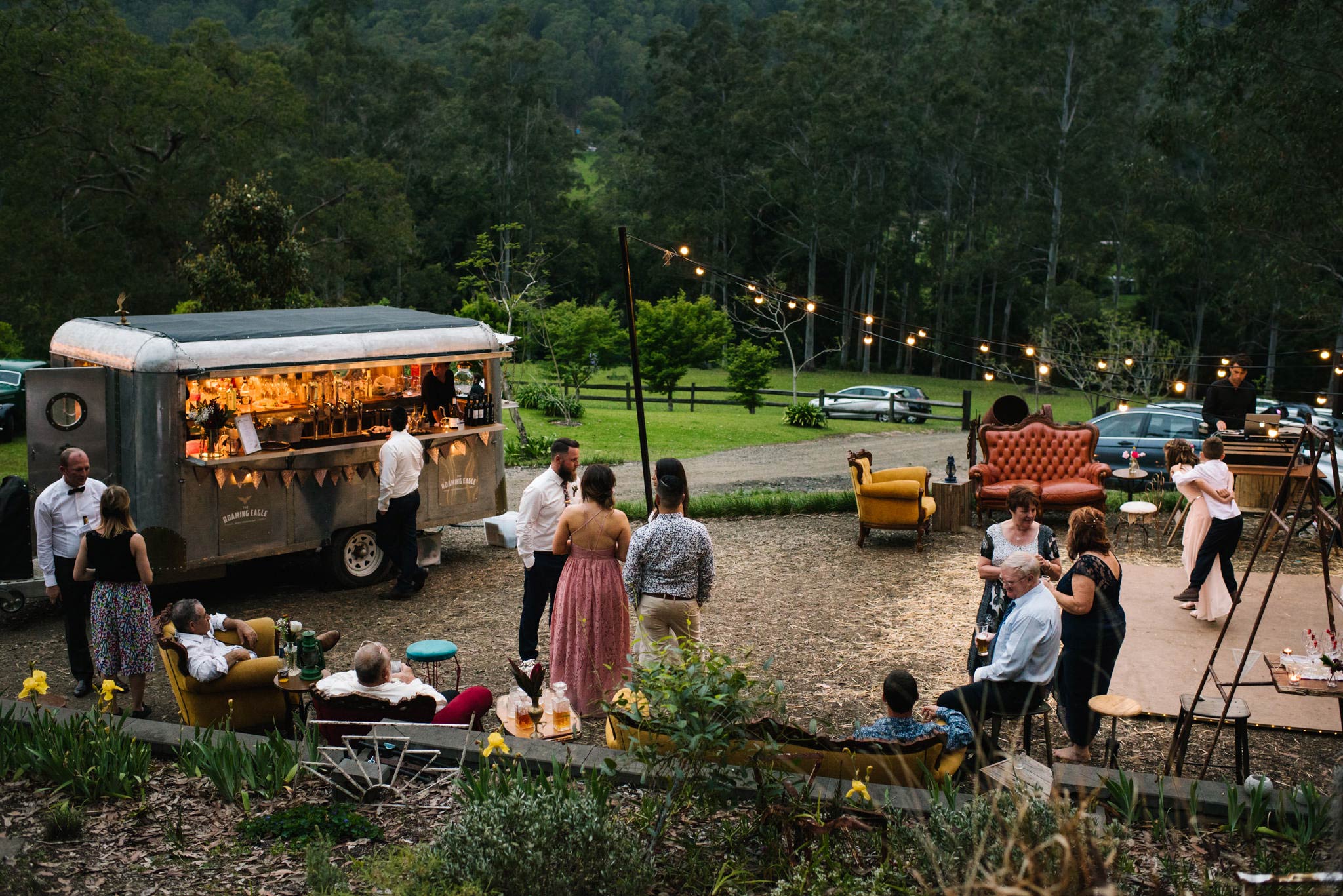 Outdoor wedding reception with festoon lights