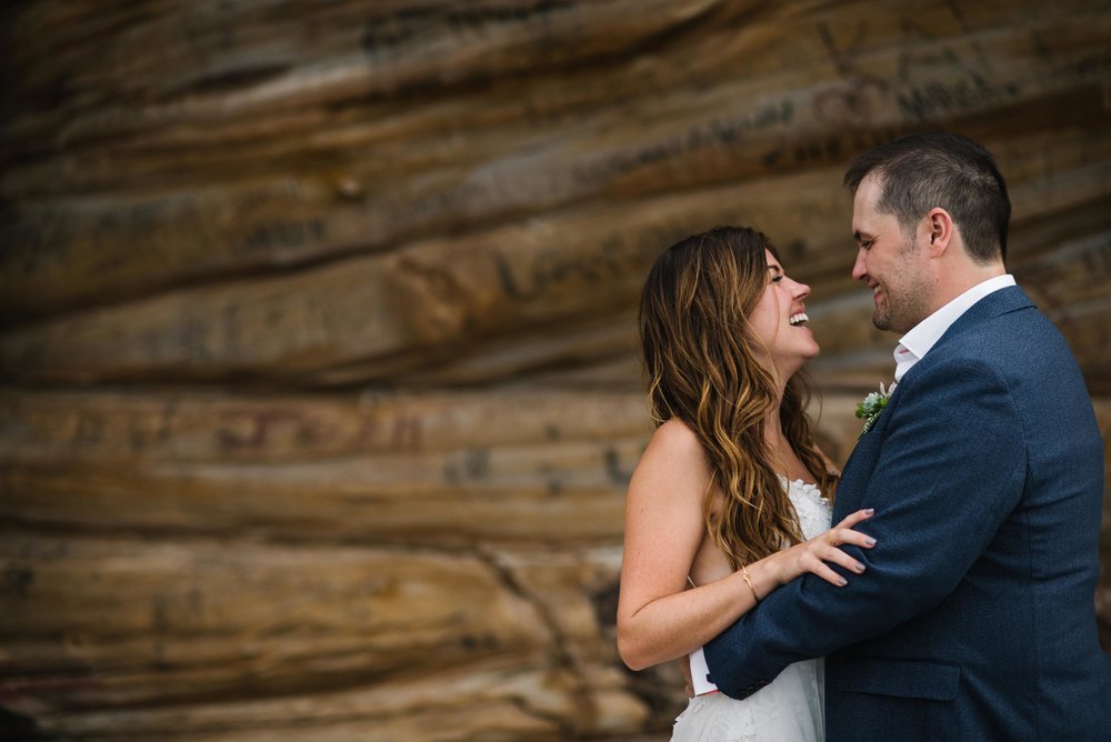 Bride and groom looking at eachother and smiling