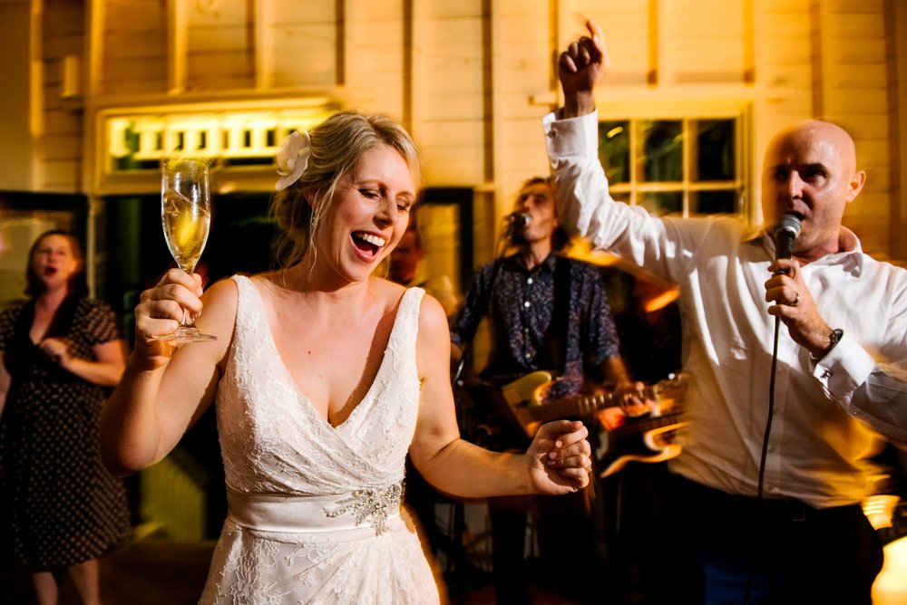 Groom singing to bride on dance floor at Athol Hall wedding