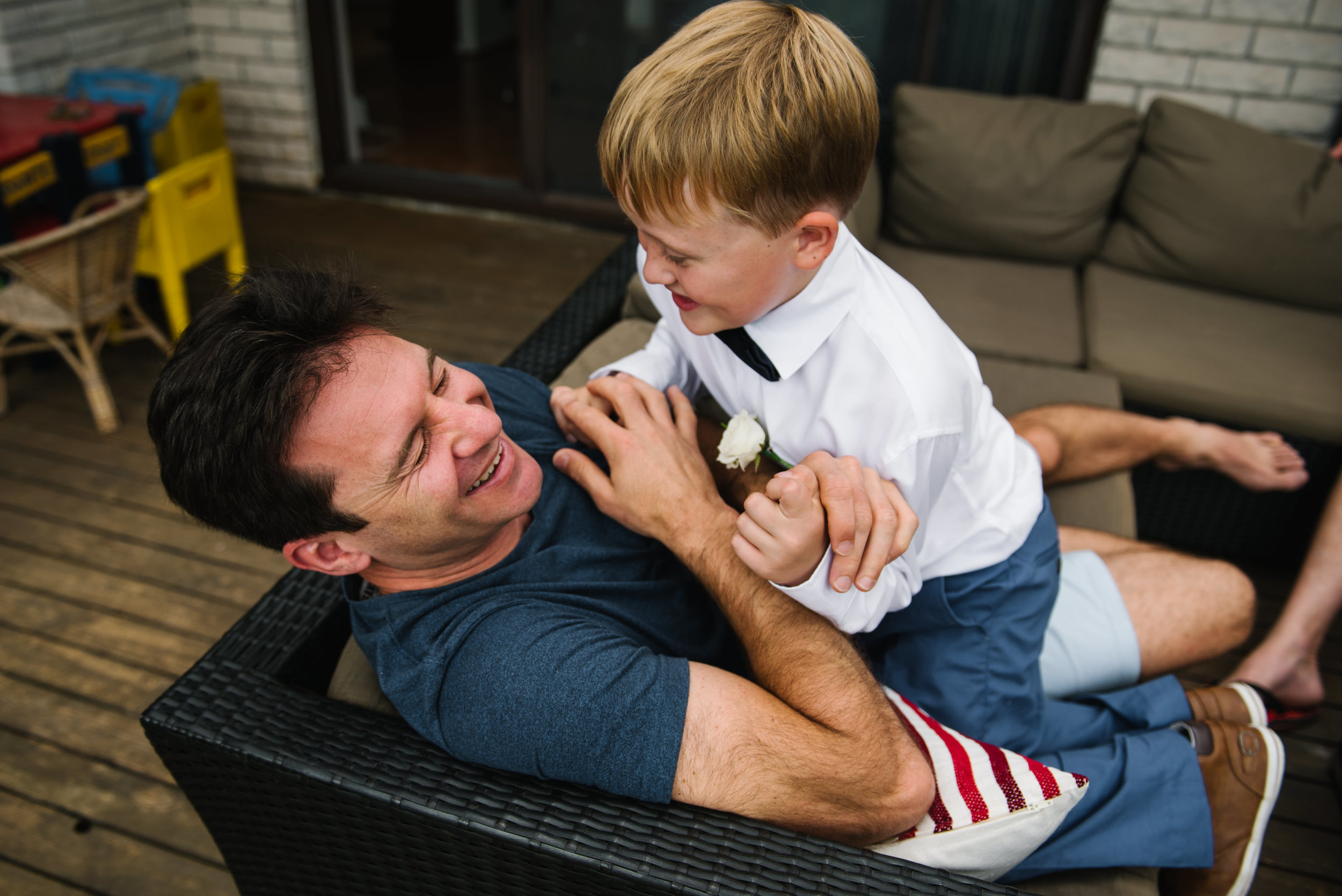 Groom playing with ring bearer