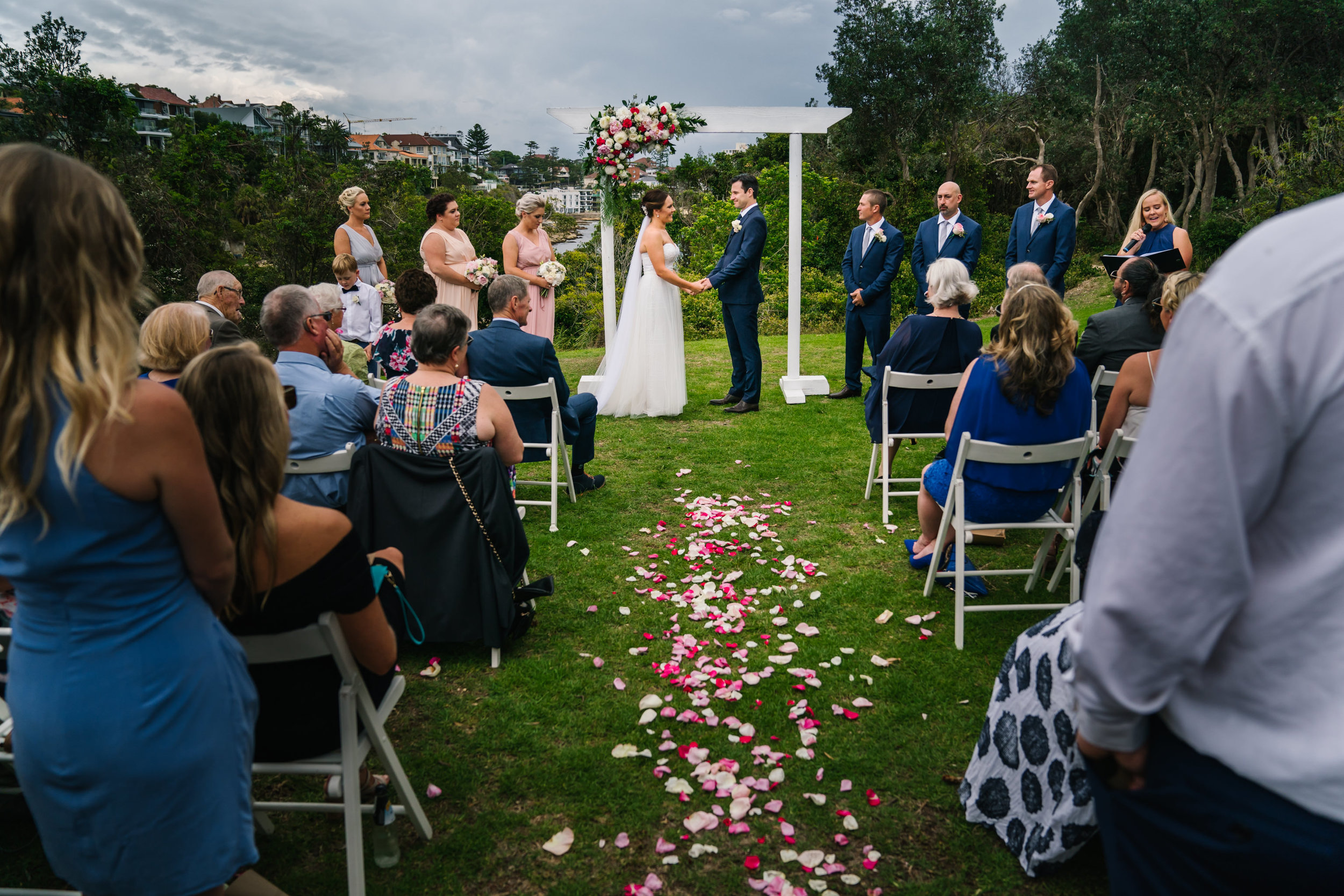 Flower petals down aisle at Shelly Beach wedding