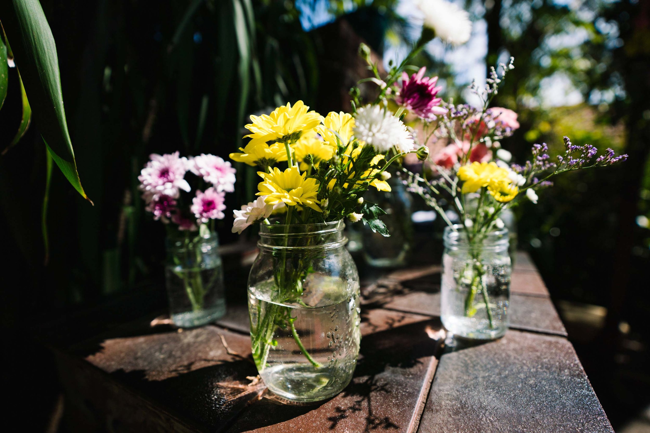 Daisies in mason jars wedding decoration