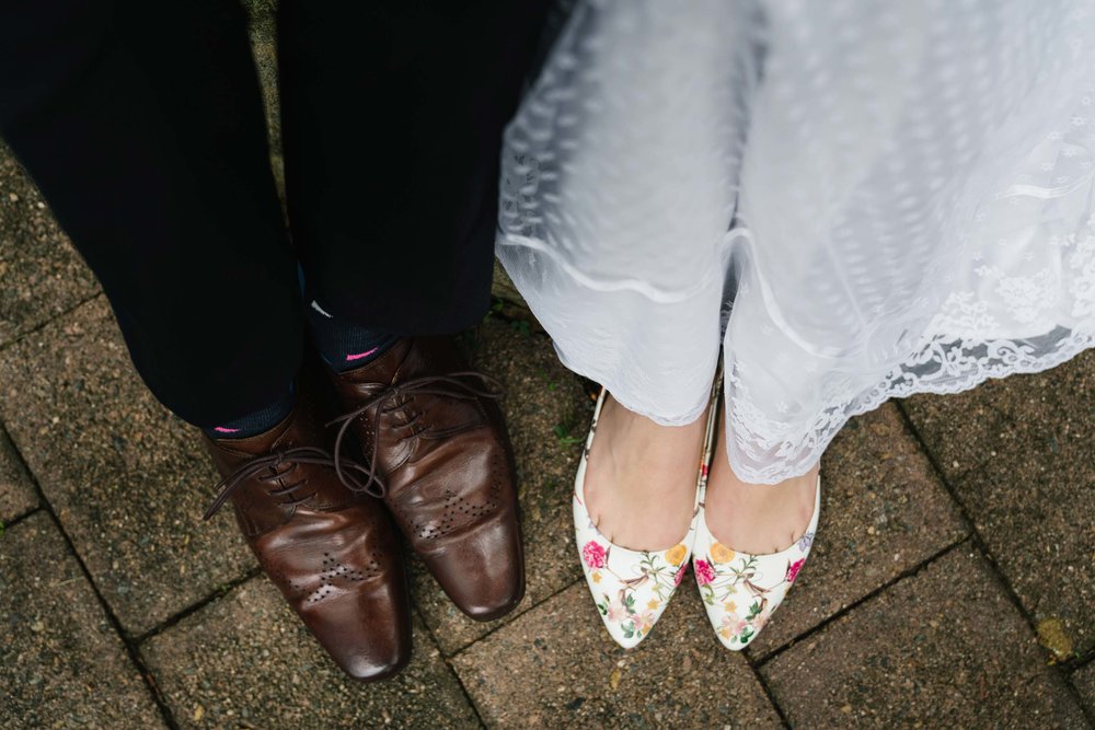 Bride in floral wedding shoes