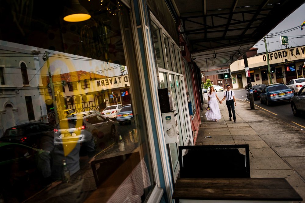 Bride and groom walking to reception at Daisy's Milk bar