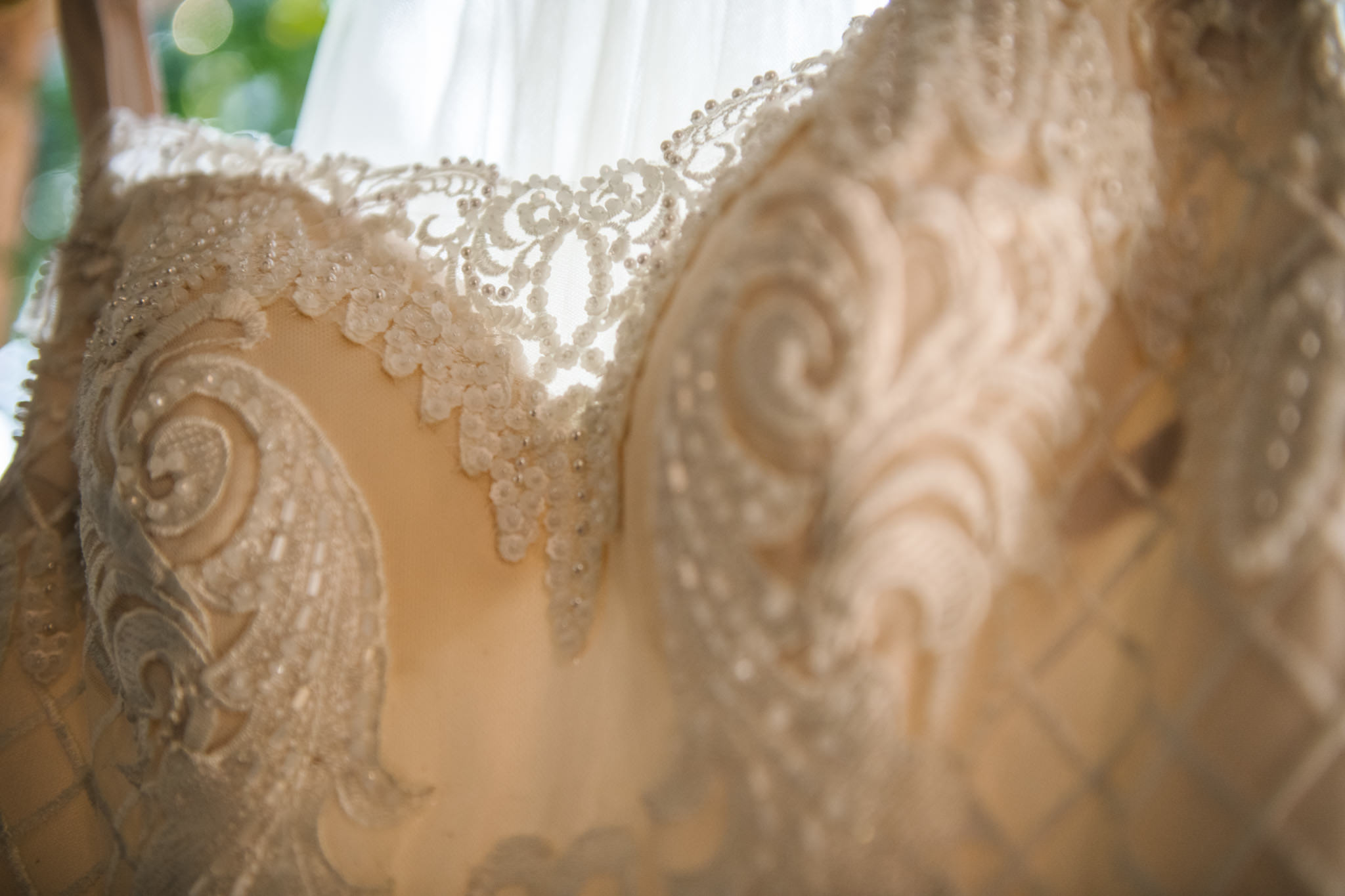 Detail of lace and beaded wedding gown