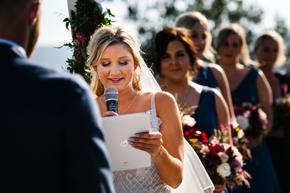 Bride crying as she reads her vows to her new husband