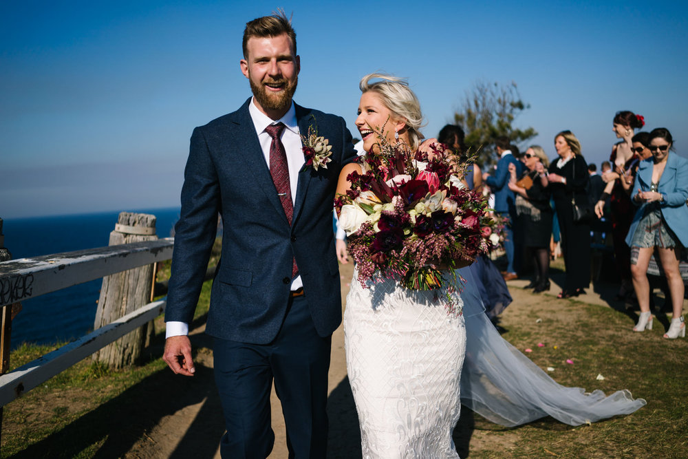 Newlyweds smiling after Northern Beaches wedding ceremony