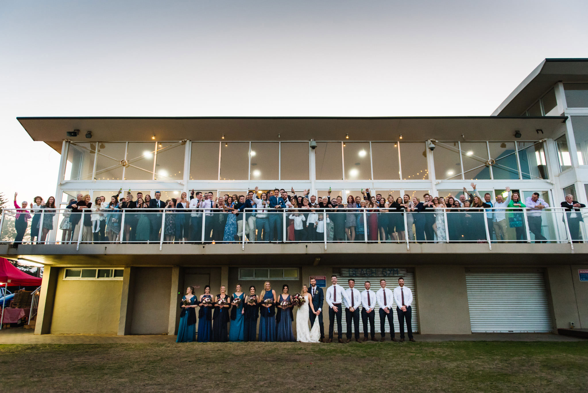 Group photo of all the guests at reception at Narrabeen Beach SLSC