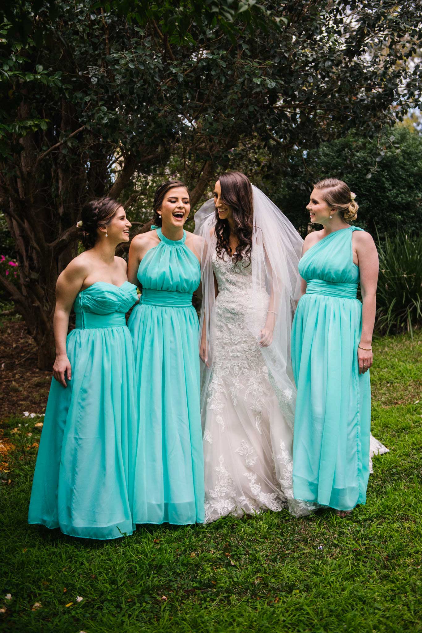 Bride and bridesmaids having fun before ceremony begins