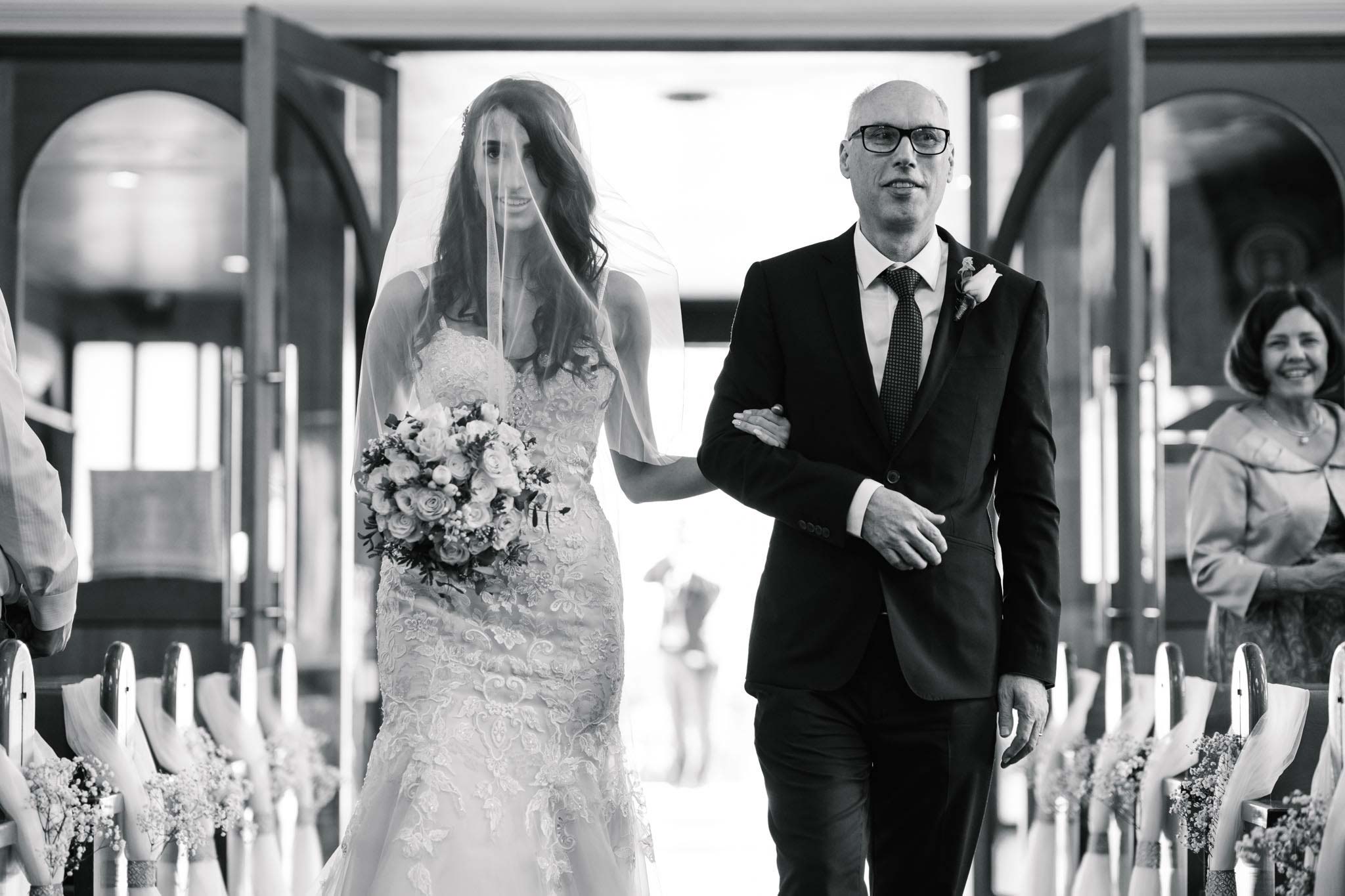 Bride and father walk down the aisle at Sydney Greek orthodox wedding