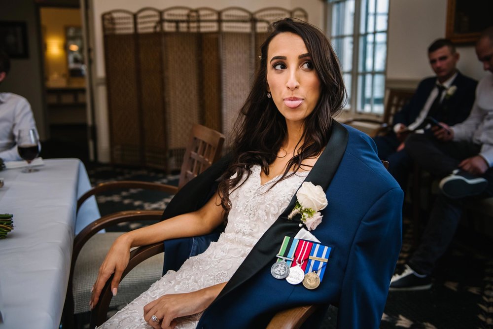 Bride sticking her tongue out during some relaxing time at Manly Golf Club