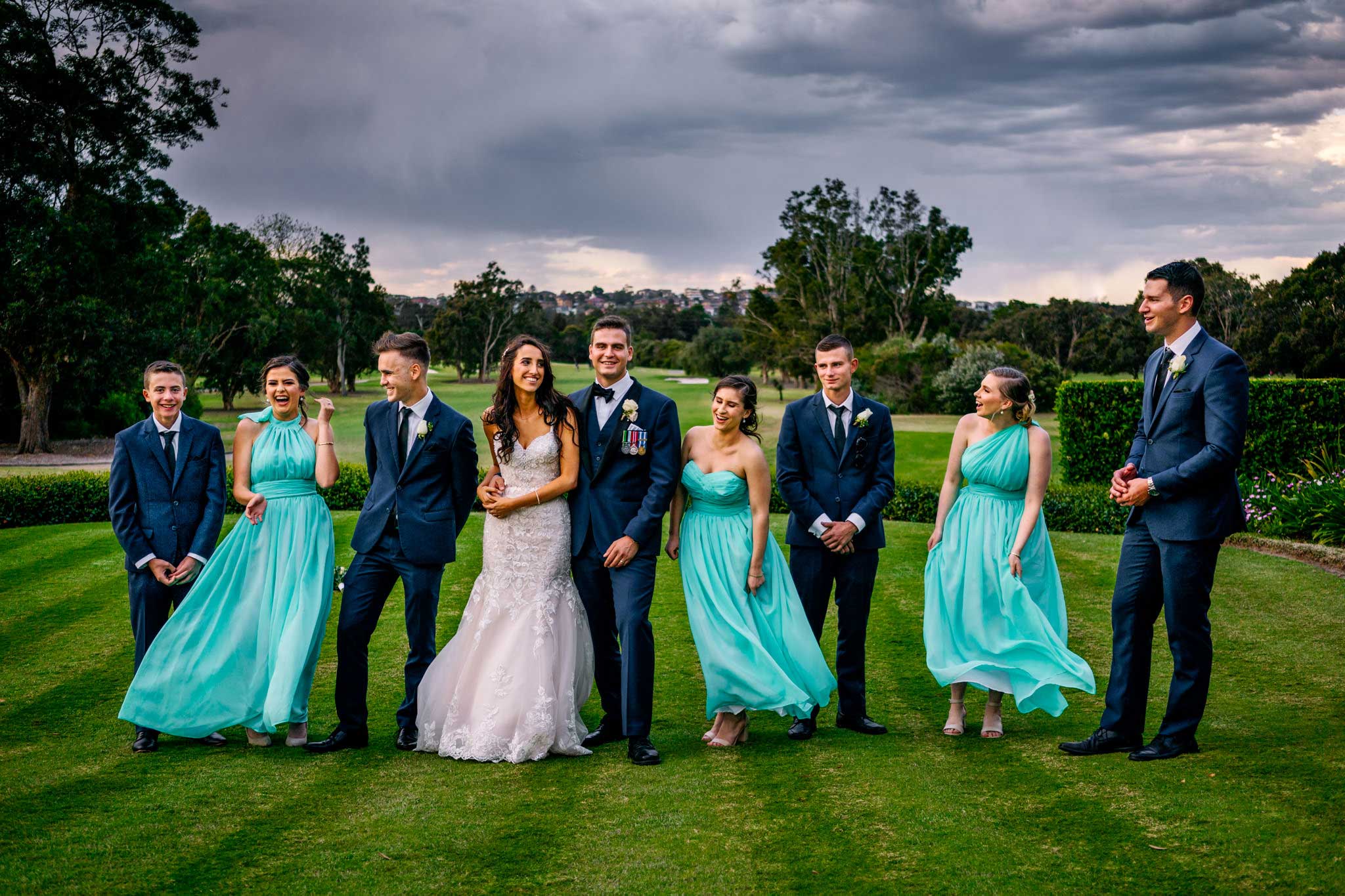 Bridal party having fun at Manly Golf Club wedding reception