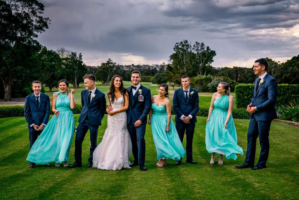 Bridal party having fun at Manly Golf Club wedding reception