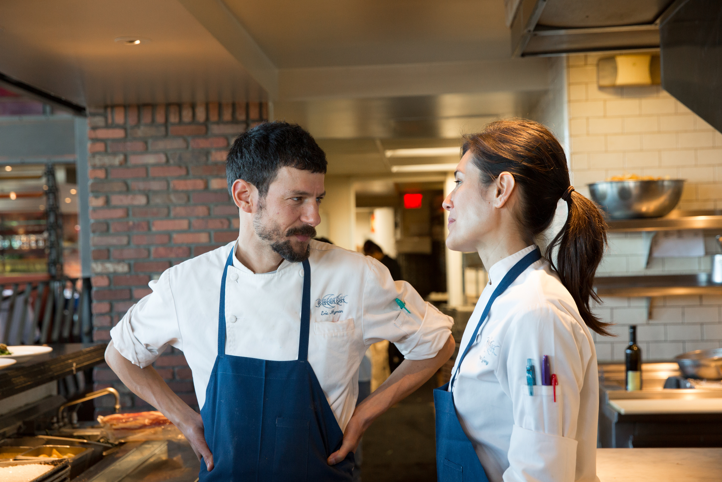 Photo of two employees talking #waterbar #waterbarsf