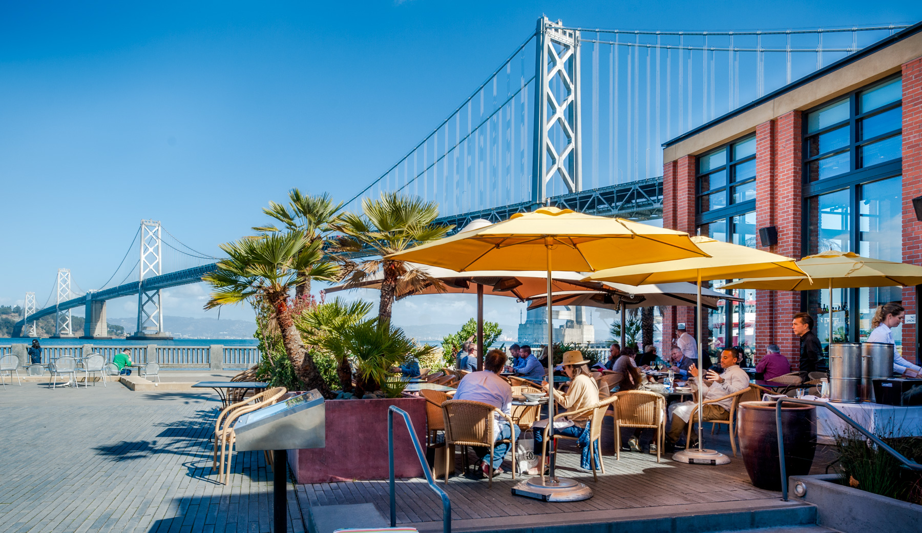 Photo of outdoor patior dining with stunning view of Bay Bridge.