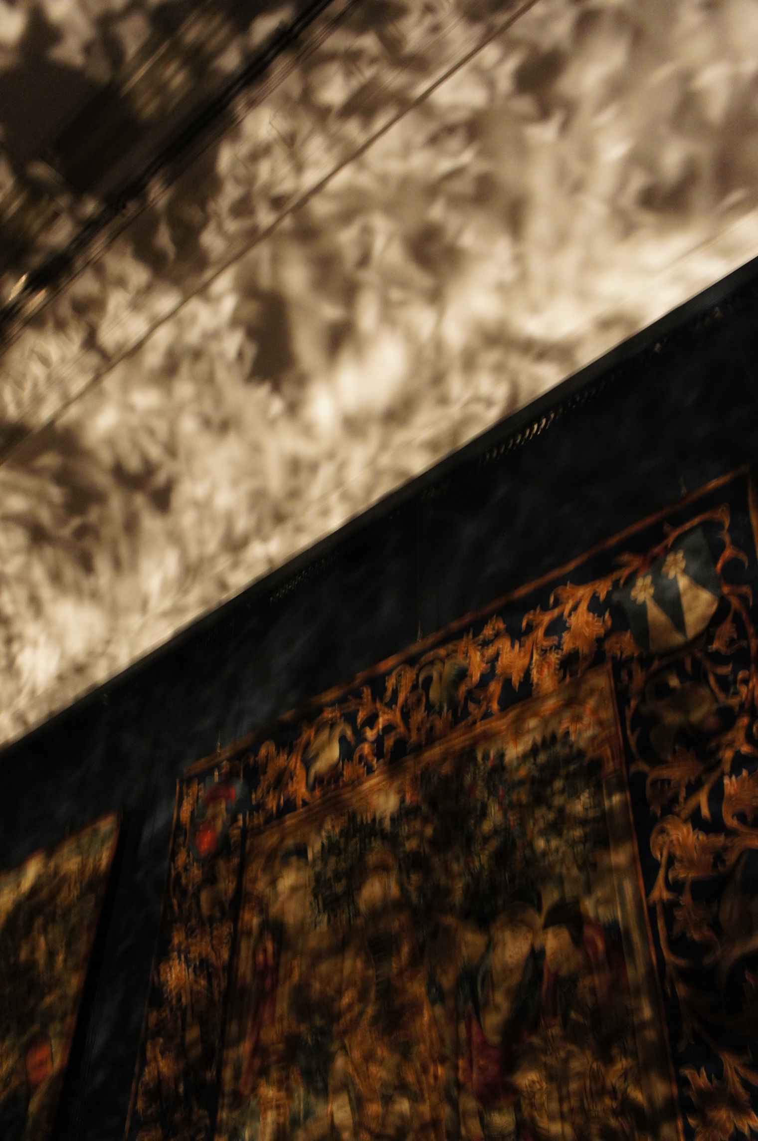 Blurred reflections on wall and ceiling from "Foil" exhibition at V&A