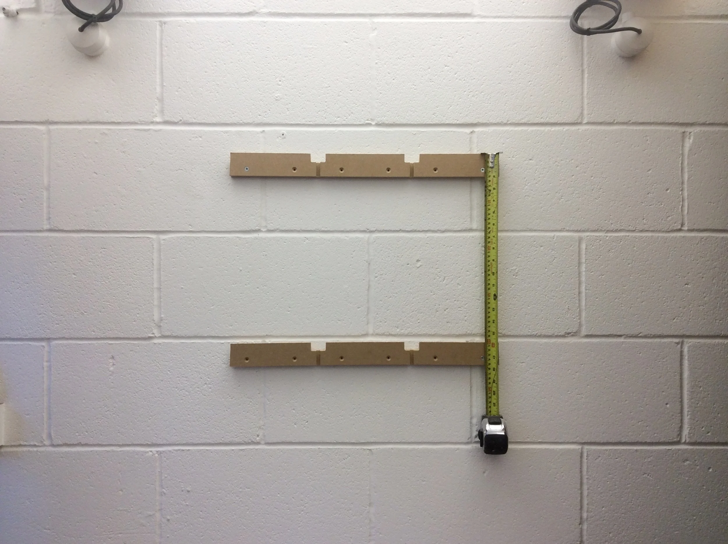 Set out next baton below, pilot hole first fix & then install first fixing then repeat for second fixing