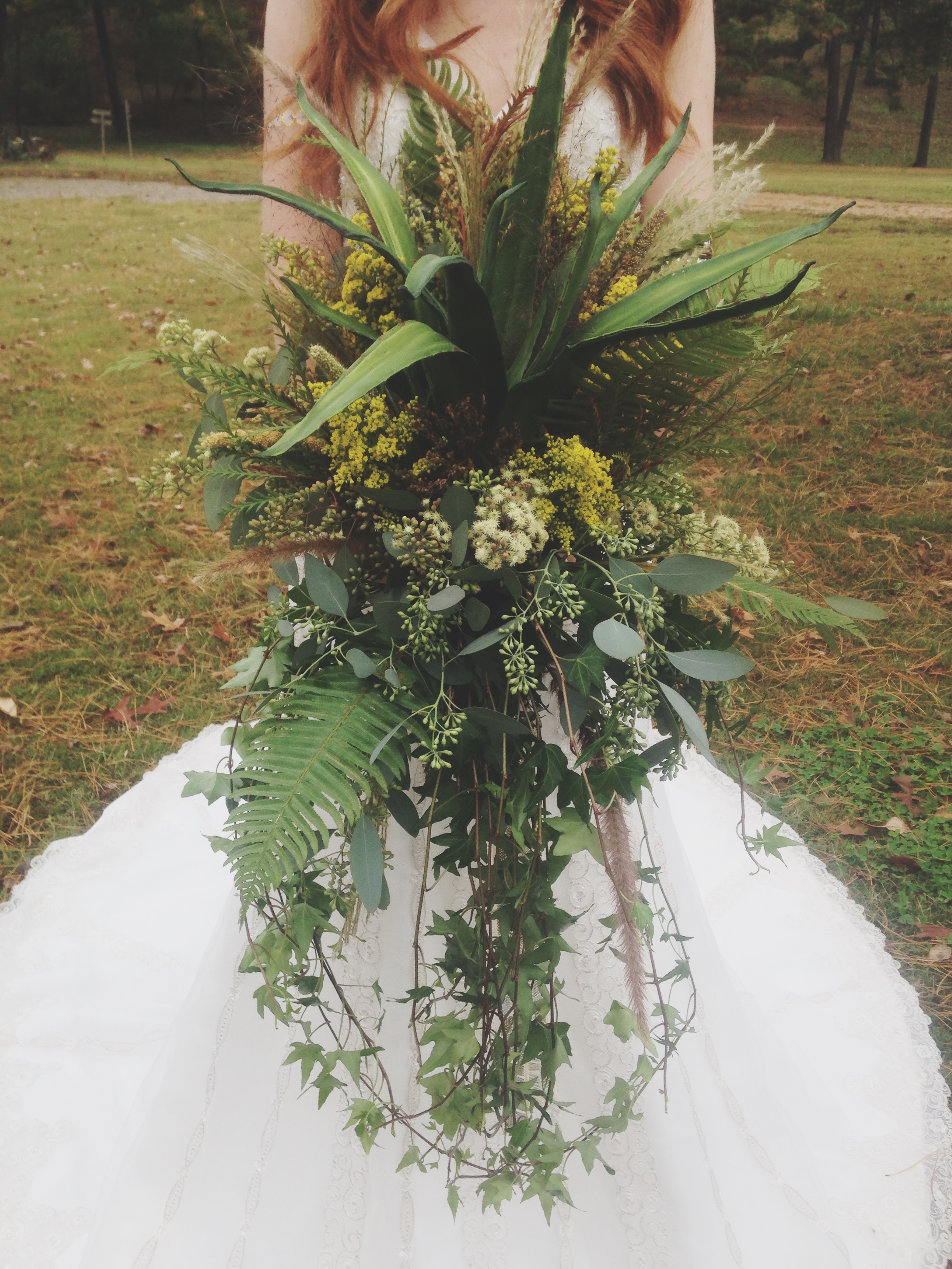 Our floral designer Ginger created this bouquet and all the fabulous headpieces and arrangements at the shoot. They were soooo gorgeous! Some of what she used came right out of The Barn's landscaping. It was stunning! (And this thing weighed like a million pounds.)
